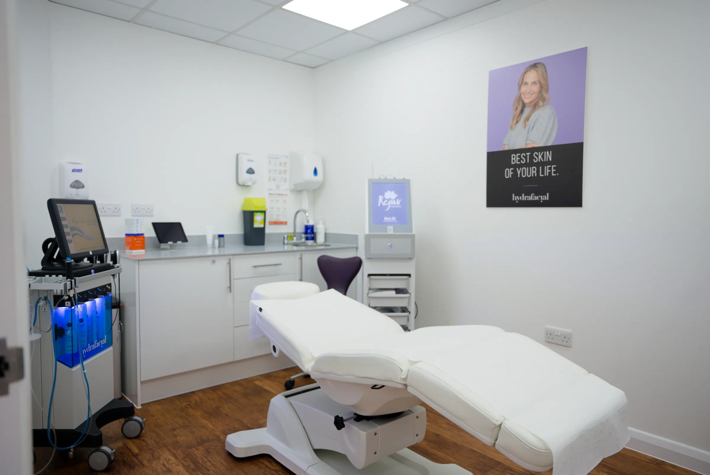 HydraFacial equipment beside a treatment couch in a clinic