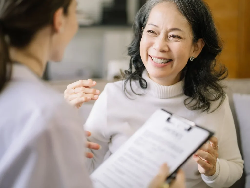 A woman doing a questionnaire with a client